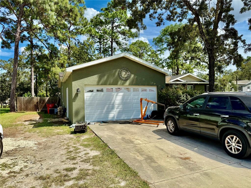5321 South June Terrace, Unit 74 Homosassa, FL 34446 - Photo 2 of 28 a car parked in front of a house