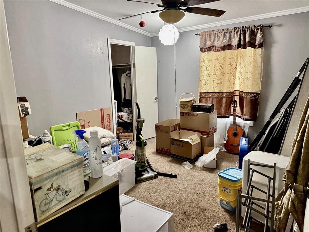 5321 South June Terrace, Unit 74 Homosassa, FL 34446 - Photo 22 of 28 a bedroom with furniture and a window