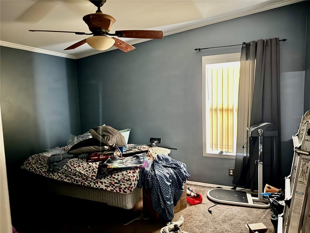 5321 South June Terrace, Unit 74 Homosassa, FL 34446 - Photo 23 of 28 a bedroom with a bed and a window