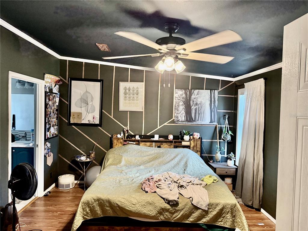 5321 South June Terrace, Unit 74 Homosassa, FL 34446 - Photo 4 of 28 a bedroom with a bed and a mirror