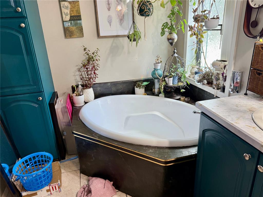 5321 South June Terrace, Unit 74 Homosassa, FL 34446 - Photo 9 of 28 a bathroom with a sink a toilet and a mirror