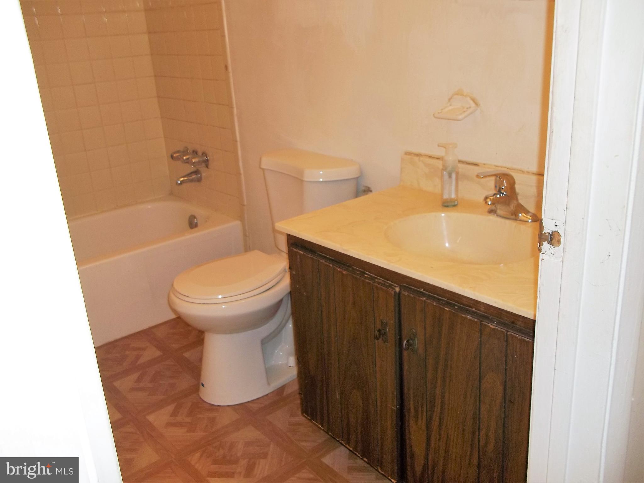 1726 Crimson Tree Way, Unit 18D Edgewood, MD 21040 - Photo 3 of 8 a bathroom with a sink and a toilet
