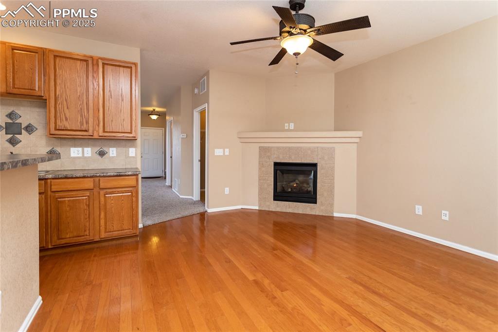 4829 Harrier Ridge Drive Colorado Springs, CO 80916 - Photo 17 of 50 a view of a kitchen with a sink and a fireplace