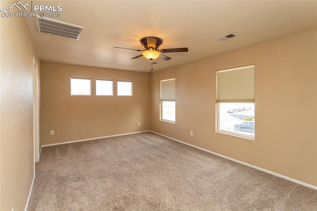 4829 Harrier Ridge Drive Colorado Springs, CO 80916 - Photo 25 of 50 a view of an empty room with a window