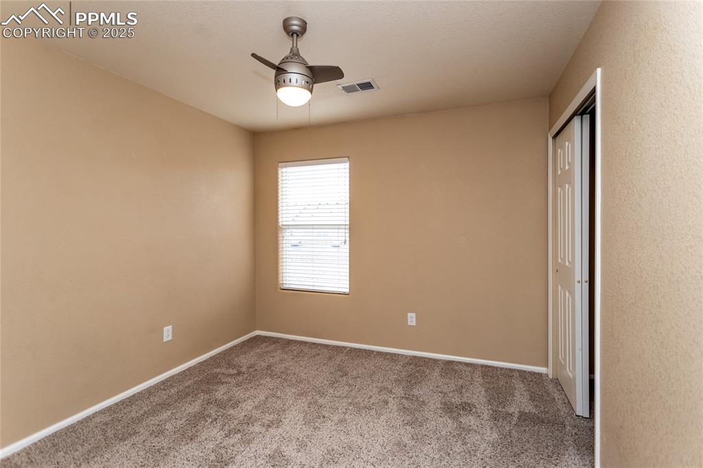 4829 Harrier Ridge Drive Colorado Springs, CO 80916 - Photo 36 of 50 an empty room with a window