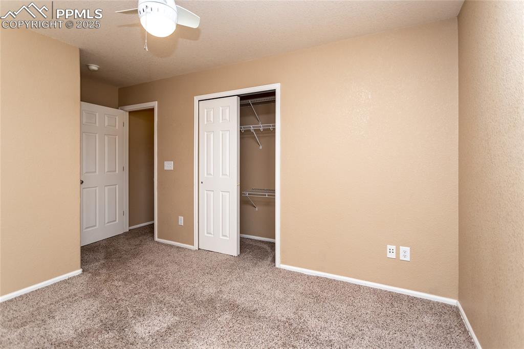 4829 Harrier Ridge Drive Colorado Springs, CO 80916 - Photo 39 of 50 an empty room with closet area