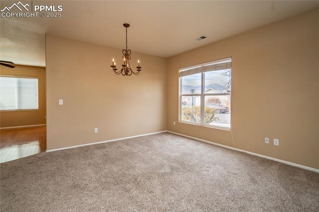 4829 Harrier Ridge Drive Colorado Springs, CO 80916 - Photo 8 of 50 an empty room with windows and entrance
