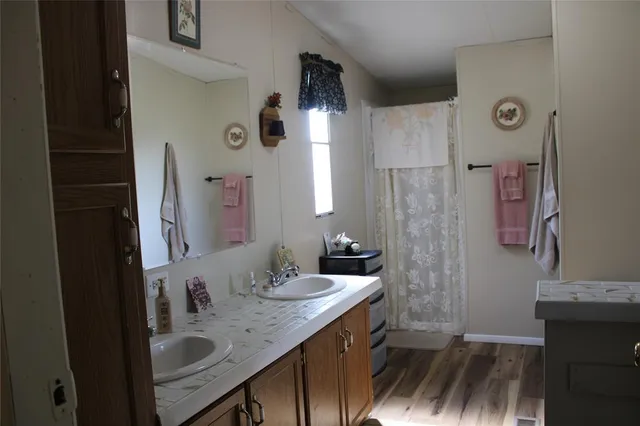 a bathroom with a sink and a mirror