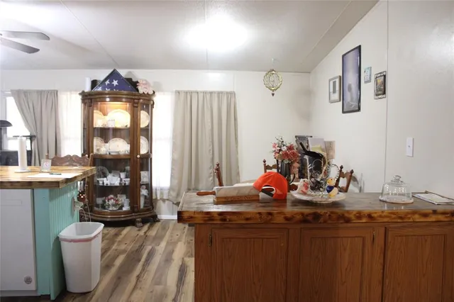 a kitchen view of a dining table chairs and entryway