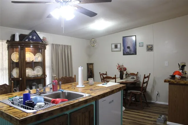 a utility room with cabinets dryer and washer