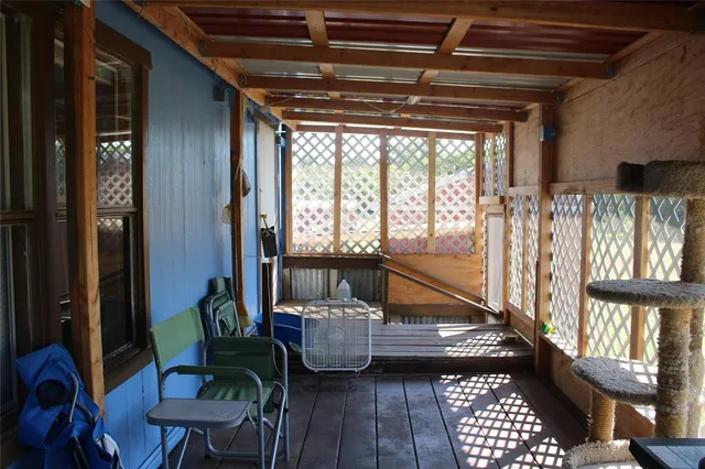 a kitchen area with granite countertop a sink stove and cabinets