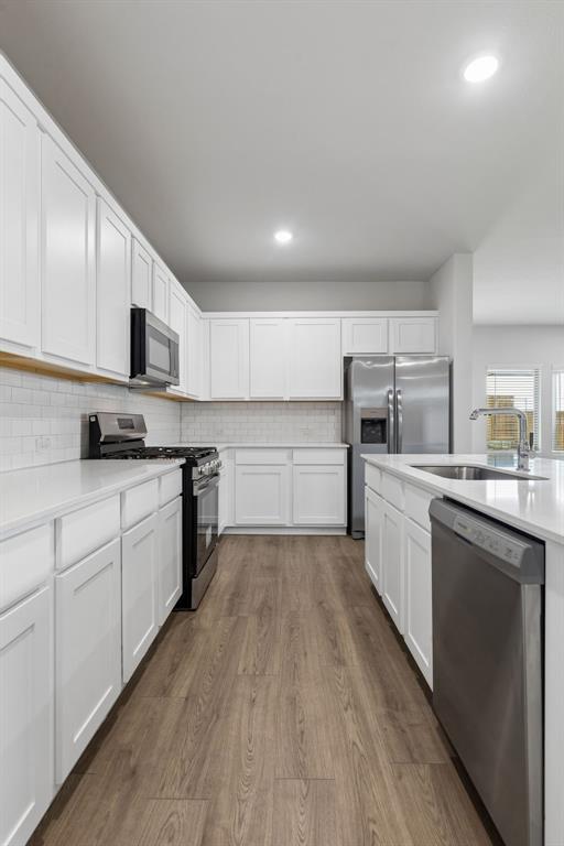 1428 Companero Street Haslet, TX 76052 - Photo 9 of 33 Kitchen in the Oscar home plan by Trophy Signature Homes – REPRESENTATIVE PHOTO