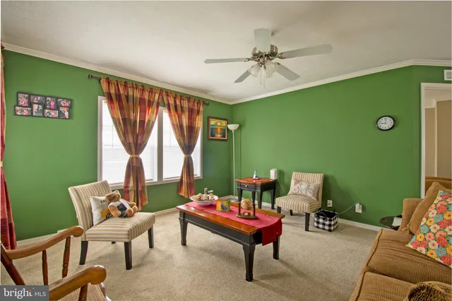 a bed sitting in a bedroom next to a large window