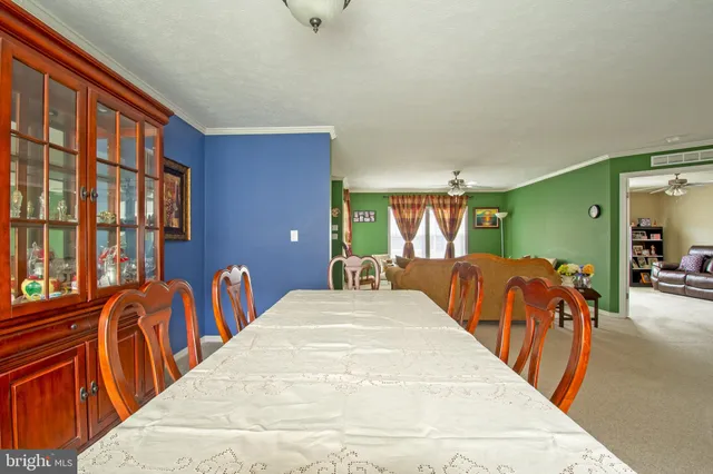 a view of a bedroom with furniture and windows