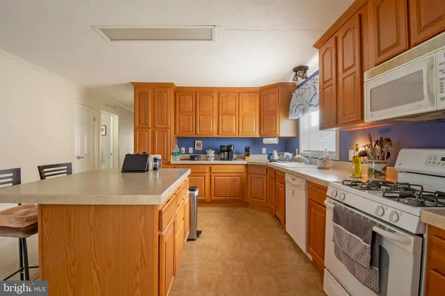 a kitchen with a sink cabinets and window