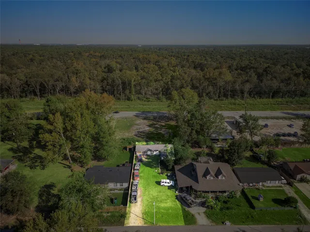 an aerial view of house with yard swimming pool and outdoor seating