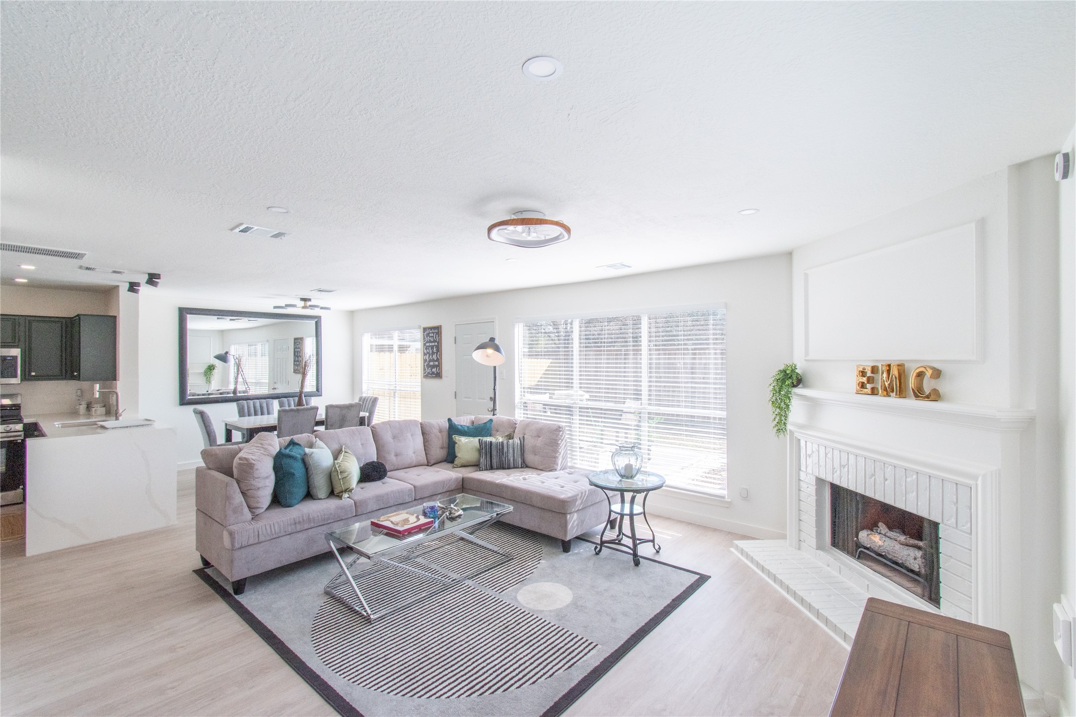 a living room with furniture and a fireplace