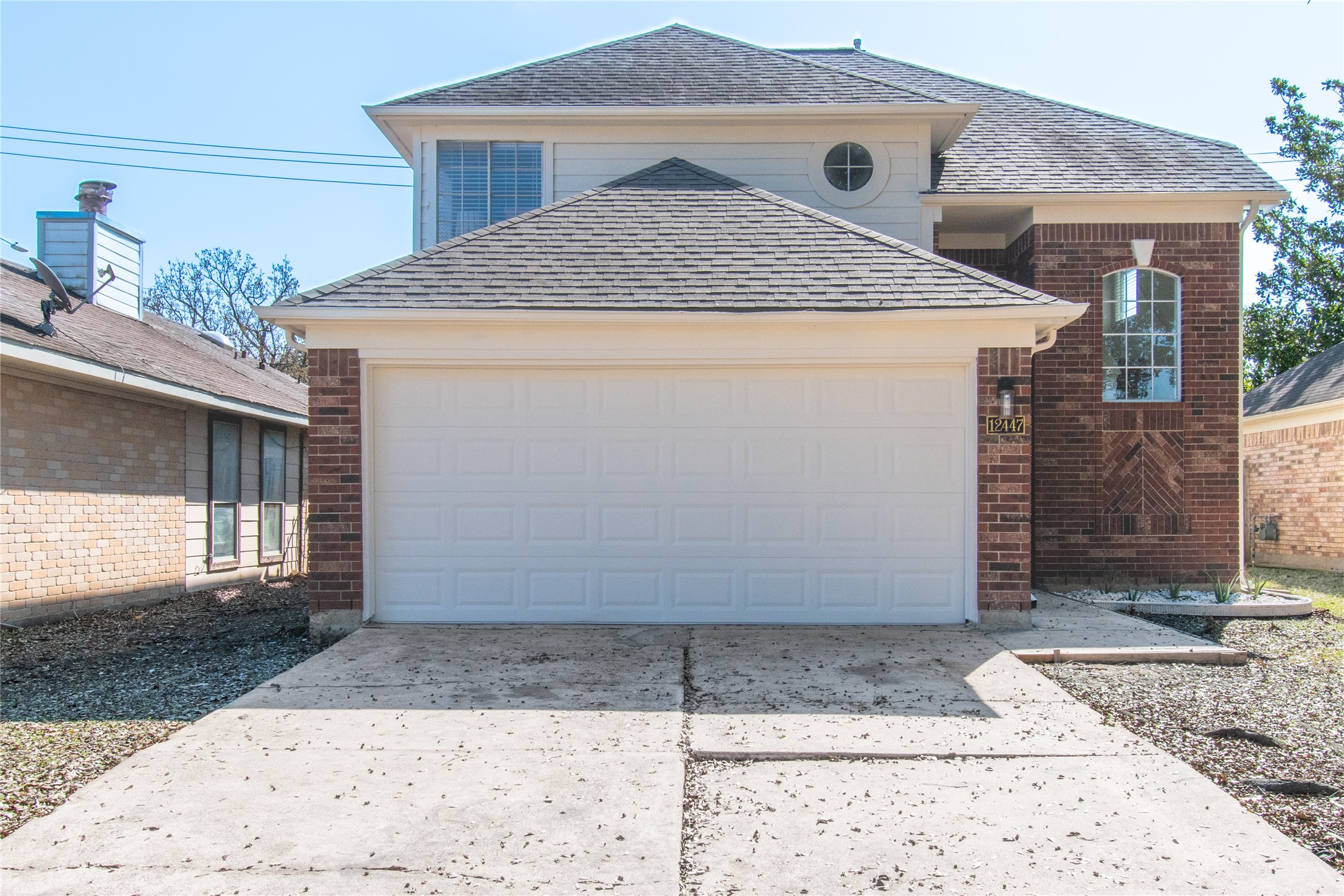12447 South Rachlin Circle Houston, TX 77071 - Photo 2 of 34 a front view of a house with garage