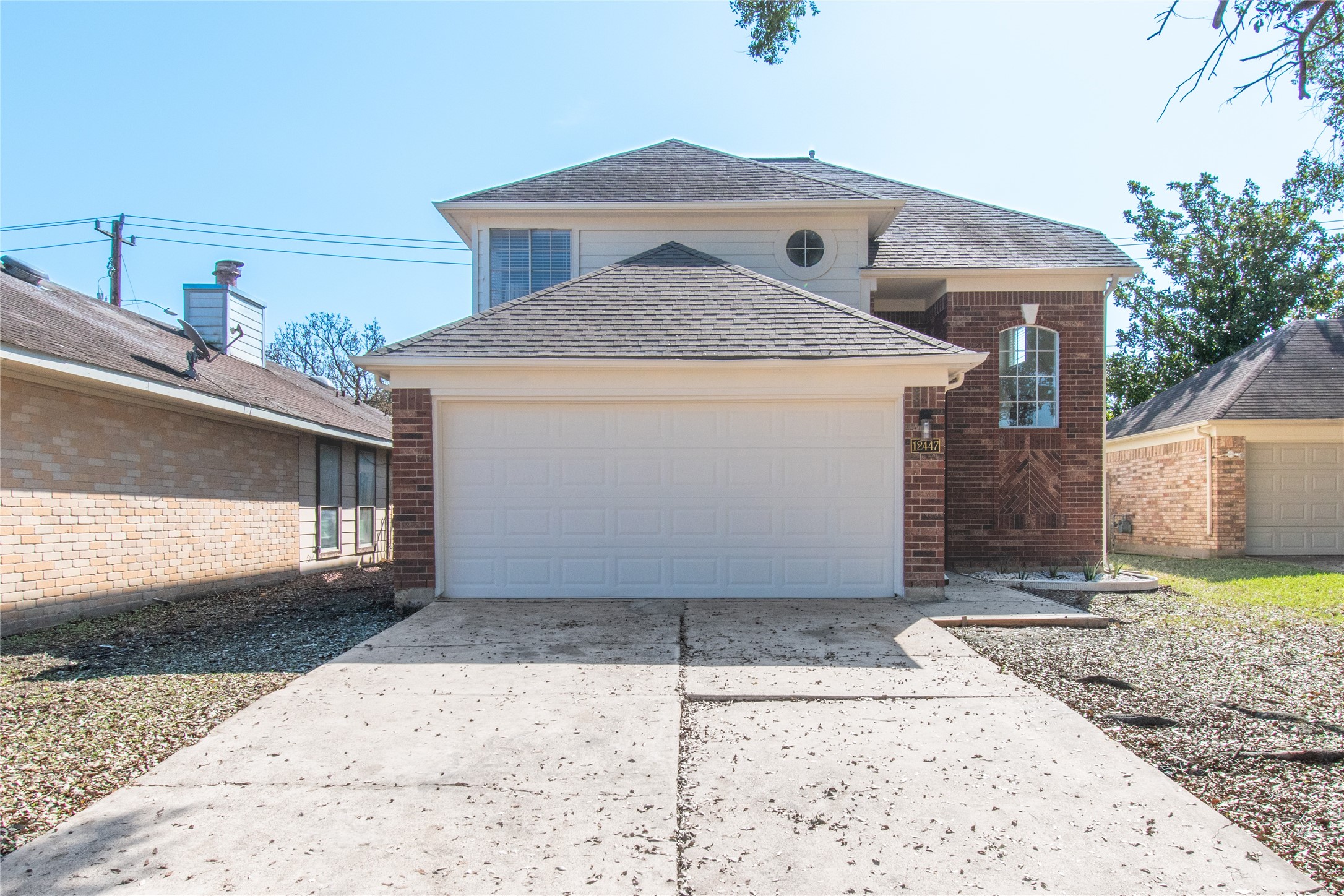 12447 South Rachlin Circle Houston, TX 77071 - Photo 3 of 34 a front view of a house with a yard
