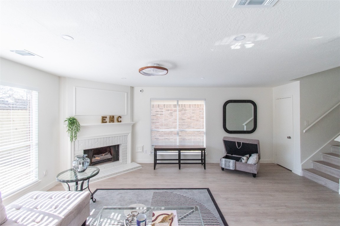 12447 South Rachlin Circle Houston, TX 77071 - Photo 8 of 34 a living room with furniture a fireplace and window