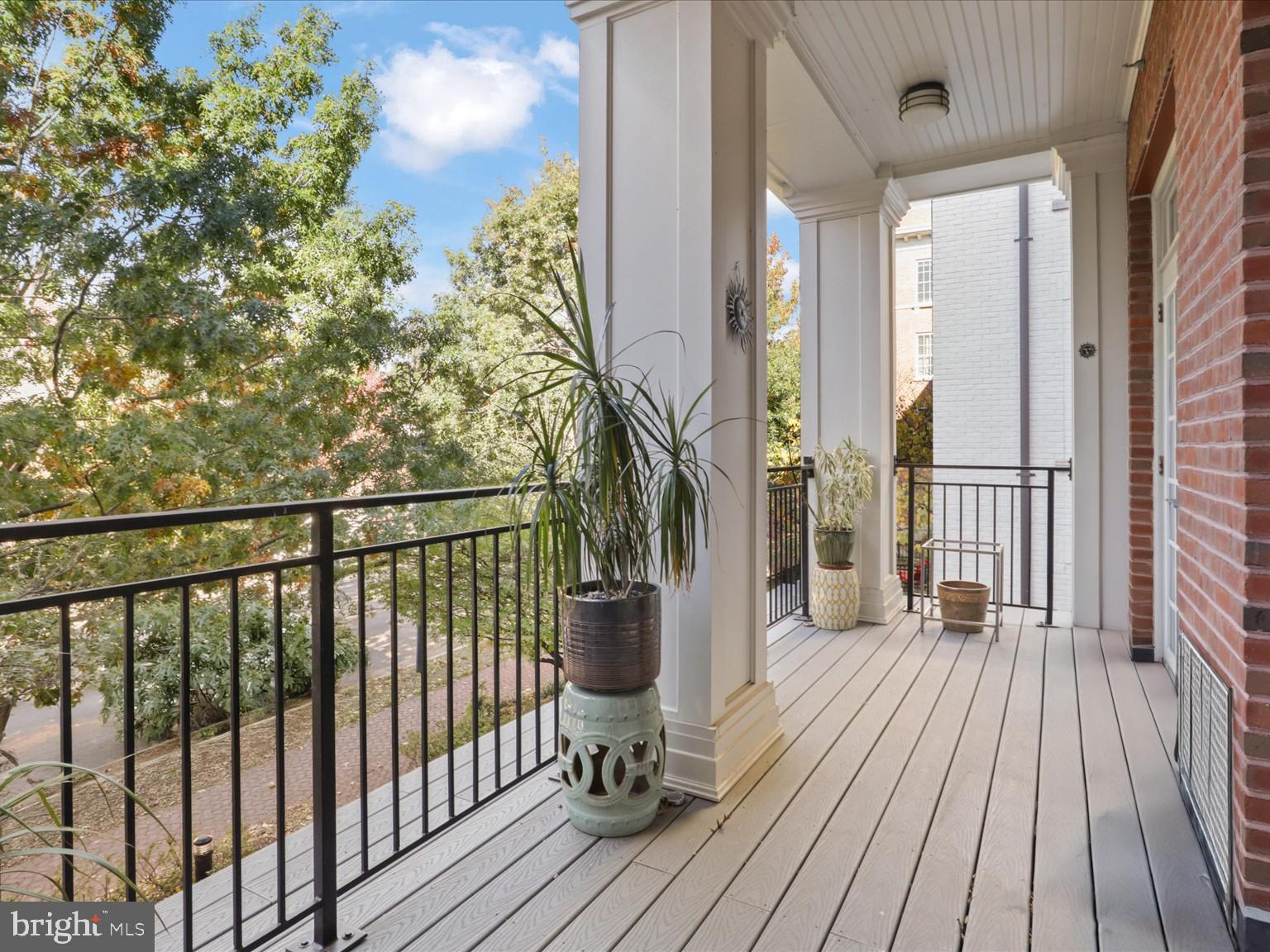 1023 North Royal Street, Unit 214 Alexandria, VA 22314 - Photo 16 of 38 a view of a balcony with wooden floor