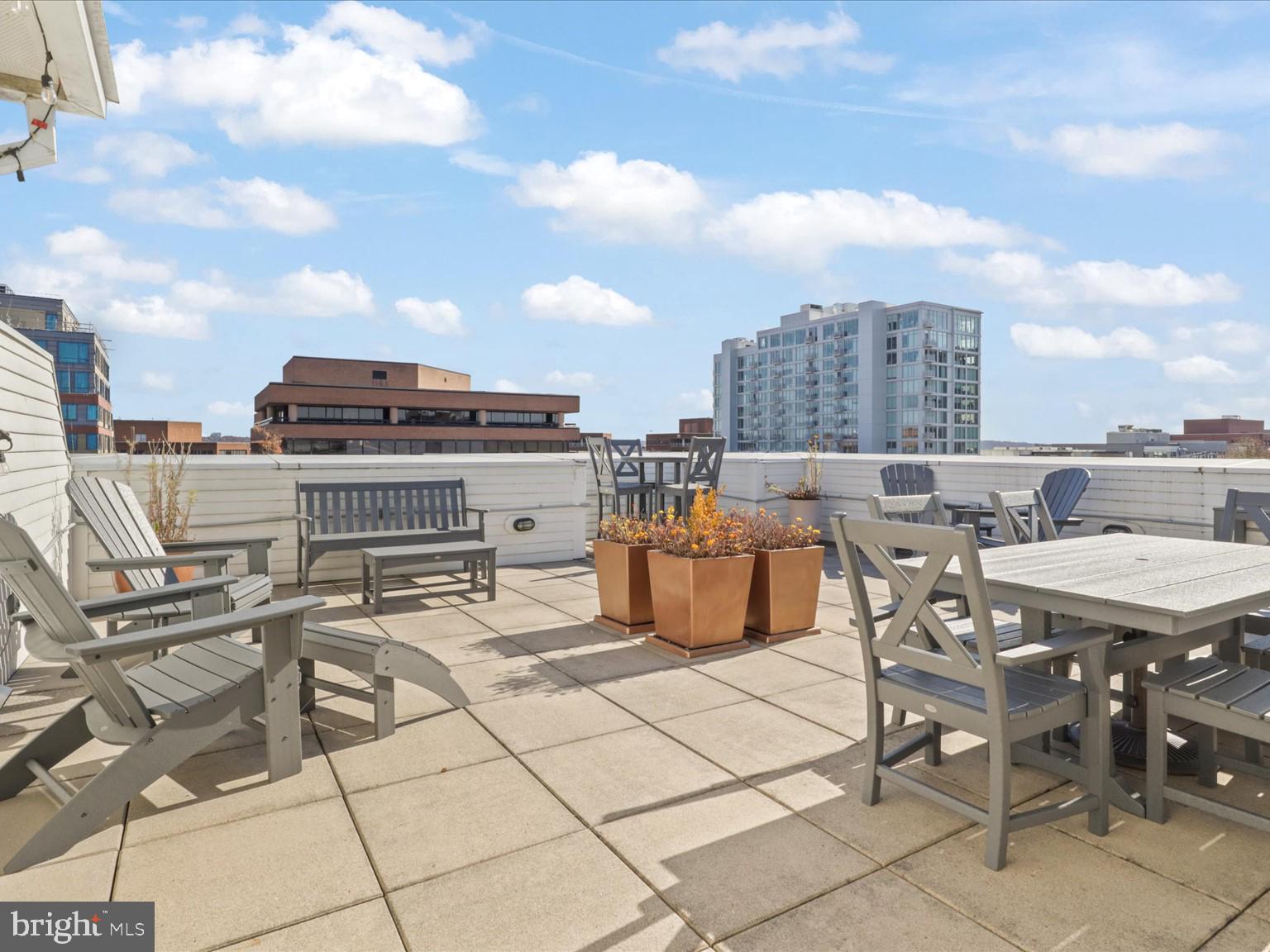 1023 North Royal Street, Unit 214 Alexandria, VA 22314 - Photo 18 of 38 a view of a terrace with furniture and stove