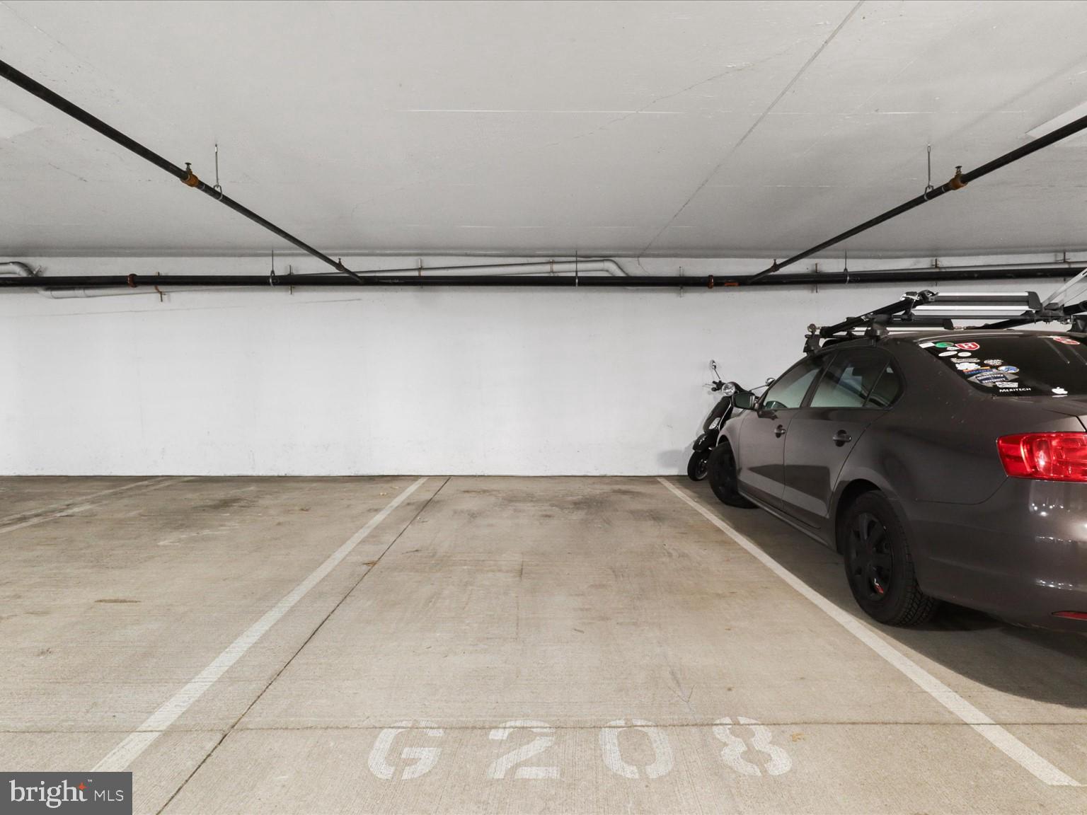1023 North Royal Street, Unit 214 Alexandria, VA 22314 - Photo 20 of 38 a view of parking garage with cars parked