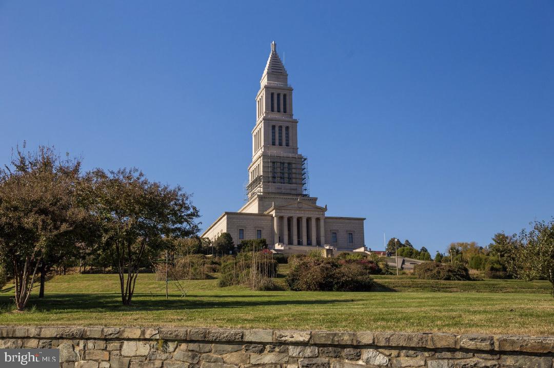 1023 North Royal Street, Unit 214 Alexandria, VA 22314 - Photo 35 of 38 a view of a big building in a big yard with large trees