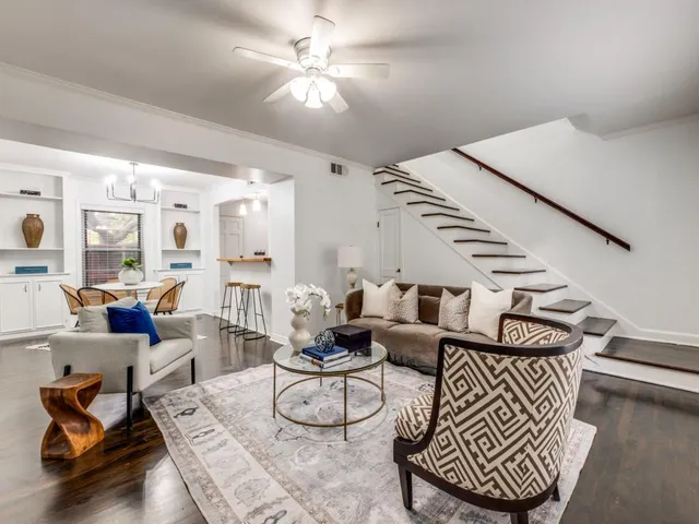 a living room with furniture or couch and a ceiling fan