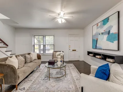 a living room with furniture and window