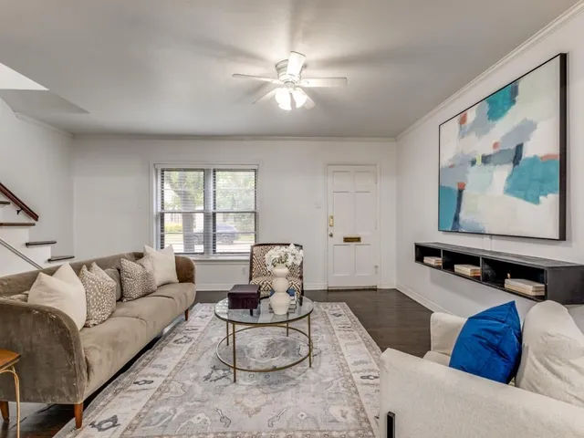 a living room with furniture and window
