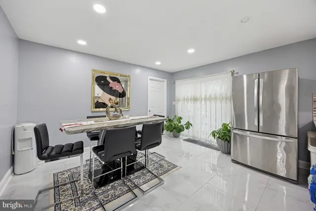 a workspace with furniture and a potted plant