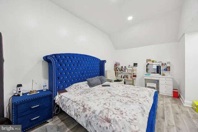 a bed room with a bed and a dresser