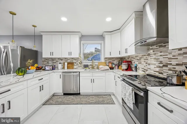 a kitchen with cabinets and appliances