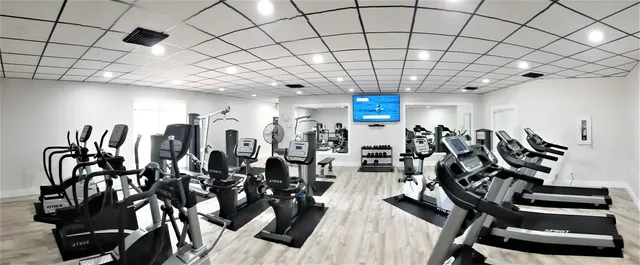 a very nice looking room with gym equipment