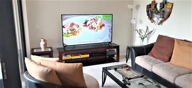 a living room with furniture and a flat screen tv