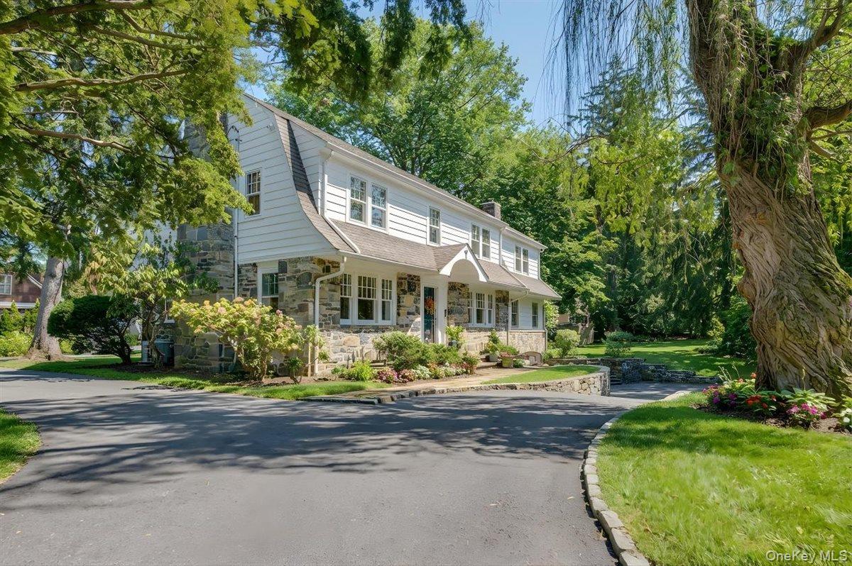 525 Milton Road Rye, NY 10580 - Photo 2 of 42 a front view of a house with a yard