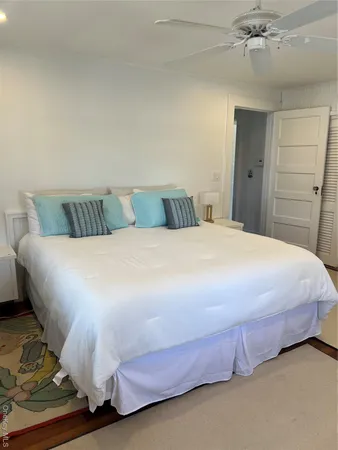 a bedroom with a bed and a table
