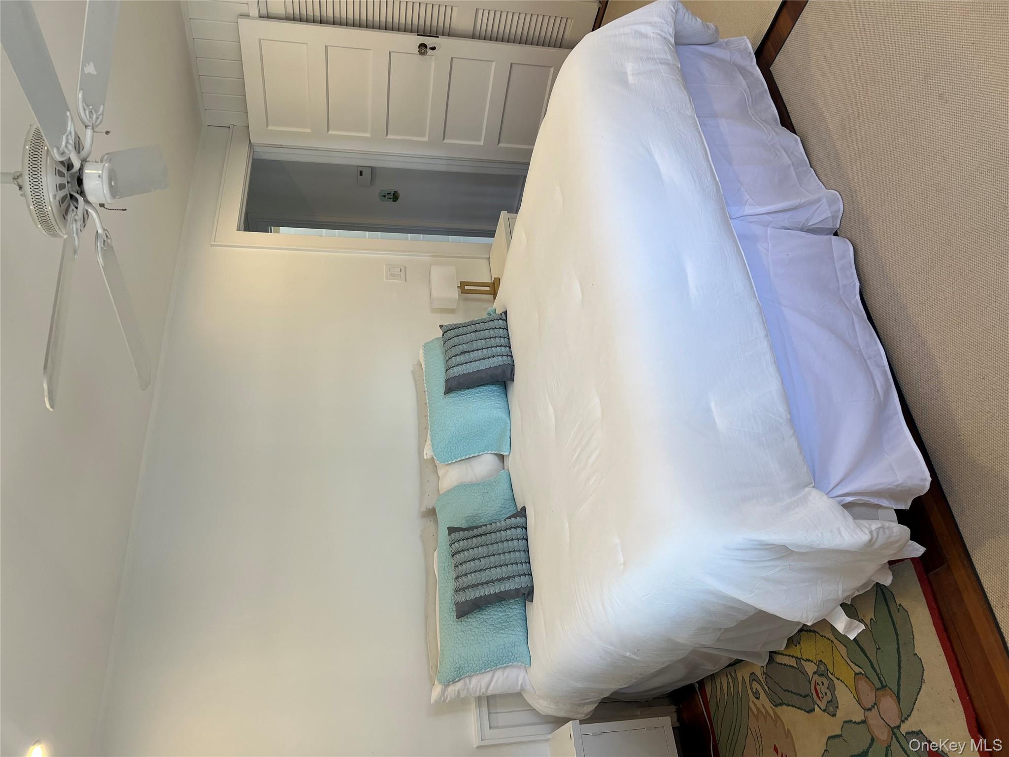 525 Milton Road Rye, NY 10580 - Photo 23 of 42 a bedroom with a bed and a table