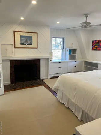a bed room with a bed and a fireplace