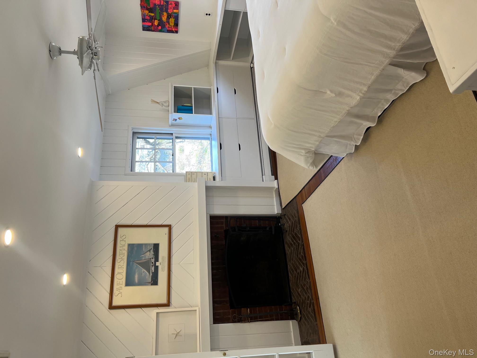 525 Milton Road Rye, NY 10580 - Photo 24 of 42 a bed room with a bed and a fireplace