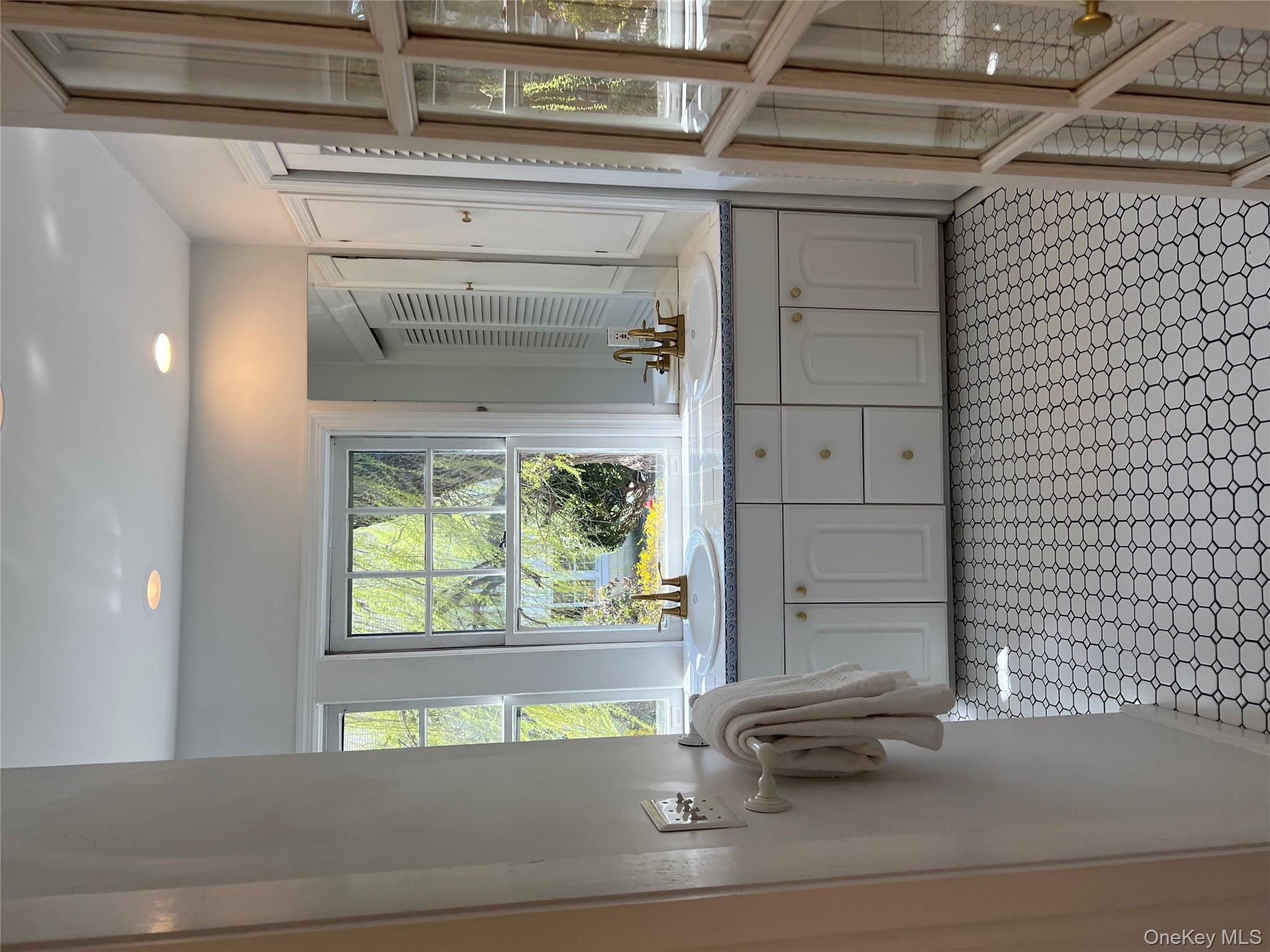 525 Milton Road Rye, NY 10580 - Photo 25 of 42 a bathroom with a double vanity sink a mirror and a shower