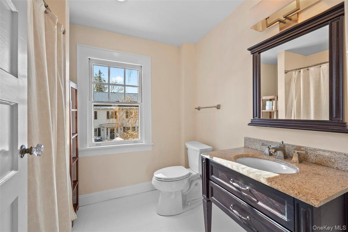 525 Milton Road Rye, NY 10580 - Photo 29 of 42 a bathroom with a granite countertop sink toilet and shower