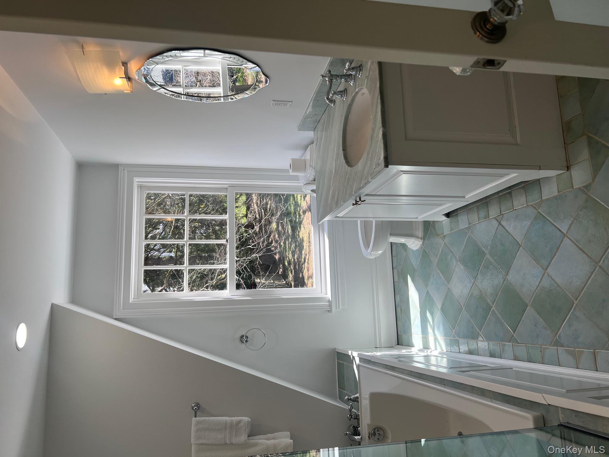 525 Milton Road Rye, NY 10580 - Photo 33 of 42 a bathroom with a granite countertop sink mirror vanity and toilet