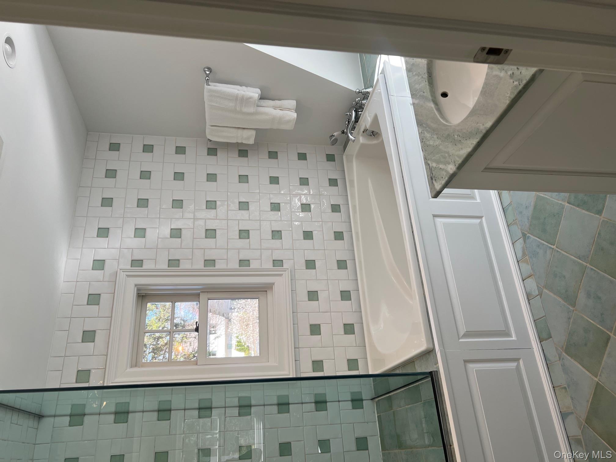 525 Milton Road Rye, NY 10580 - Photo 34 of 42 a bathroom with a sink a toilet and shower