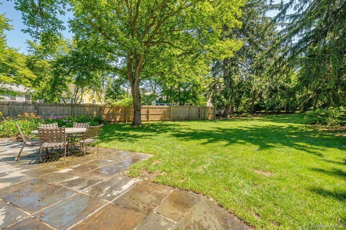 525 Milton Road Rye, NY 10580 - Photo 5 of 42 a backyard of a house with fountain table and chairs