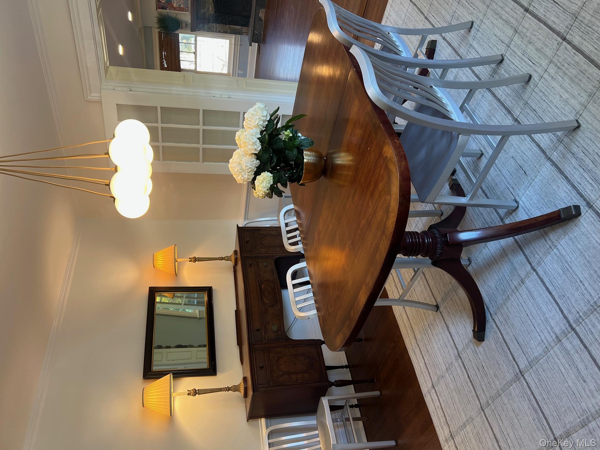525 Milton Road Rye, NY 10580 - Photo 9 of 42 a view of a dining room with furniture and wooden floor
