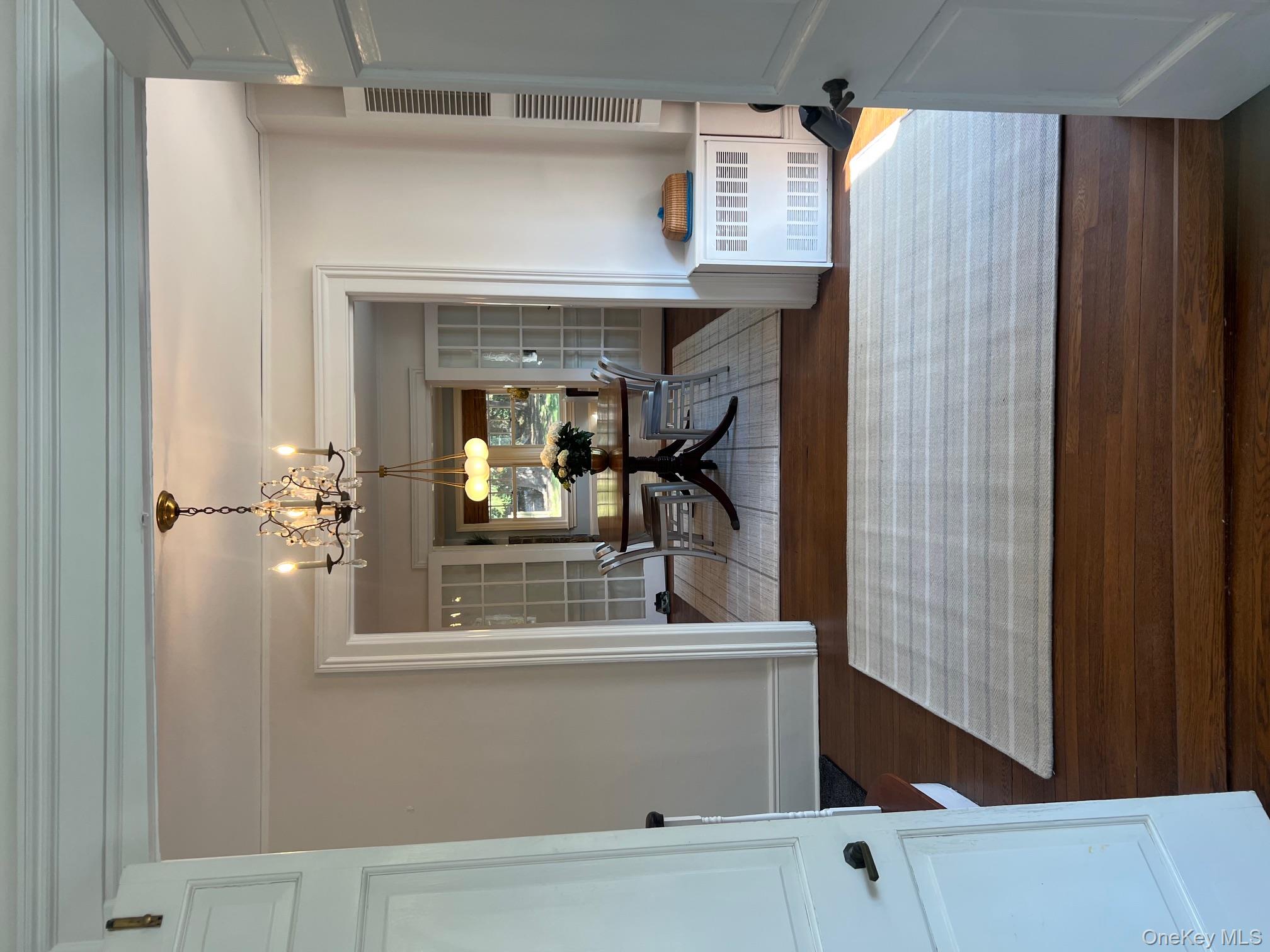 525 Milton Road Rye, NY 10580 - Photo 10 of 42 a living room with furniture and a chandelier