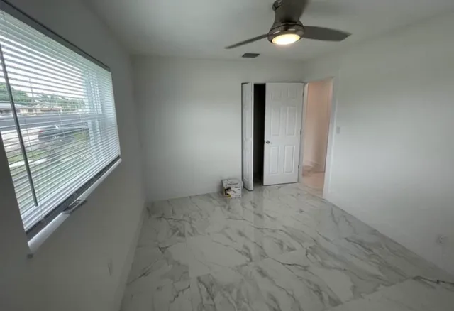 a view of an empty room with a window