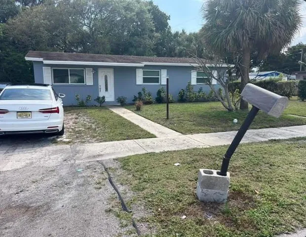 a house view with a backyard space